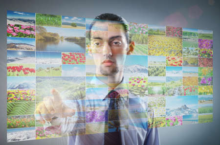 Businessman pressing virtual buttons