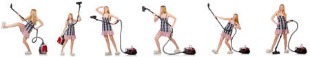 Young woman with vacuum cleaner on whiteの写真素材