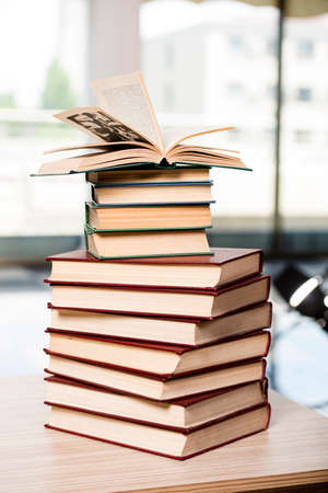Stack of books arranged the office deskの写真素材