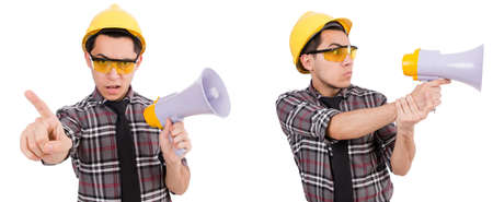 Young construction worker with loudspeaker isolated on whiteの写真素材