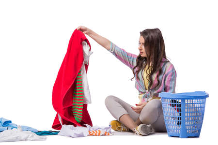 Woman tired after doing laundry isolated on whiteの写真素材