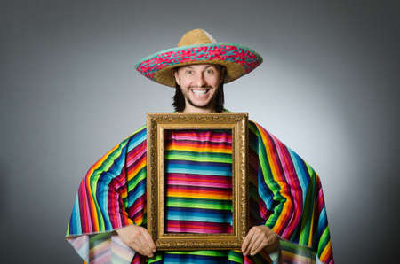 Funny man with sombrero and picture frameの写真素材