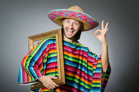 Funny man with sombrero and picture frameの写真素材