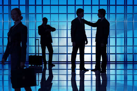 Business people walking in the office centerの写真素材