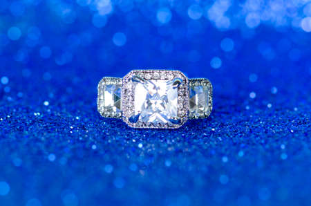 Jewellery ring against blue backgroundの写真素材