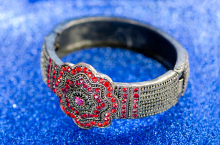 Jewellery ring against blue background