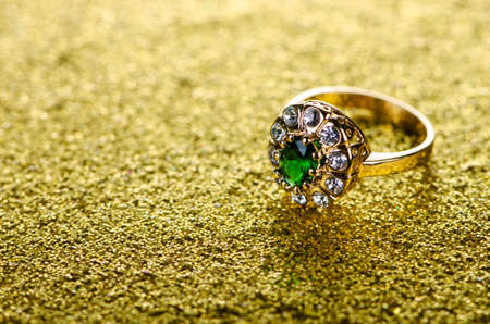 Jewellery ring against shiny background
