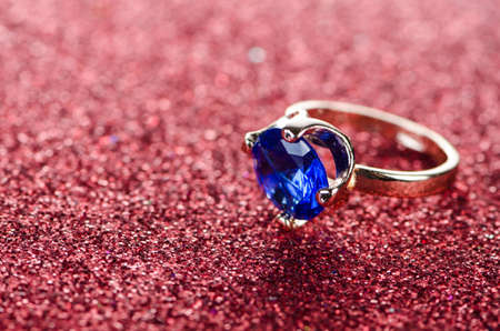Jewellery ring against shiny background
