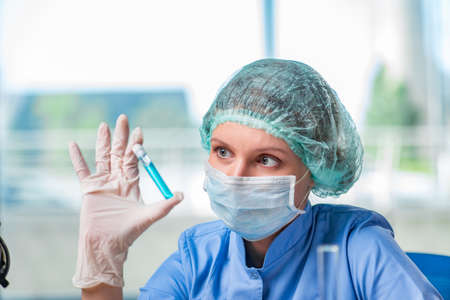 Experienced lab assistant working on chemical solutions