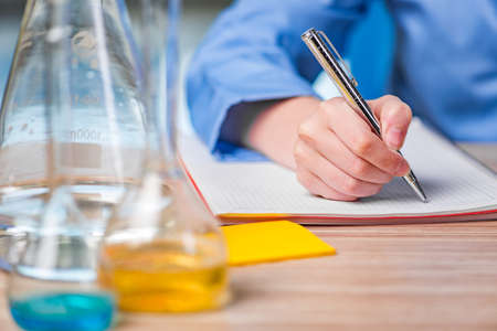 Experienced lab assistant working on chemical solutionsの写真素材