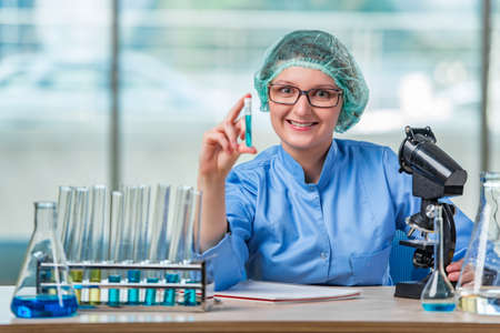 Experienced lab assistant working on chemical solutions