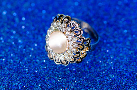 Jewellery ring against blue backgroundの写真素材