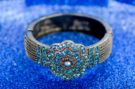 Jewellery ring against blue background
