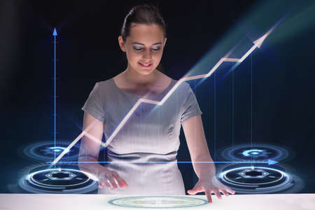 Young businesswoman with chart diagrams