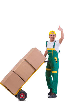 Young man moving boxes with cart isolated on whiteの写真素材