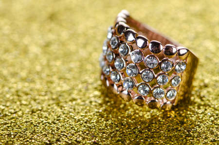 Jewellery ring against shiny background