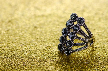 Jewellery ring against shiny background