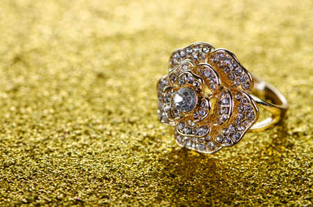 Jewellery ring against shiny background