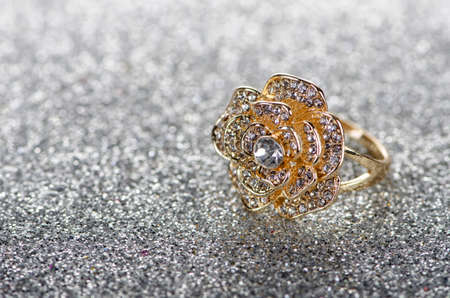 Jewellery ring against shiny background