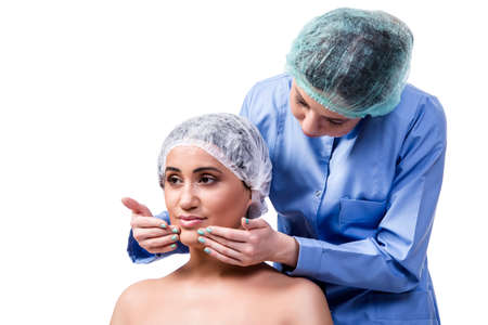 Young woman preparing for plastic surgery isolated on whiteの写真素材