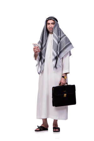 Arab man with his mobile phone isolated on whiteの写真素材