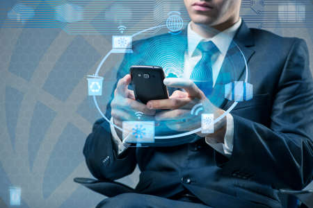 Man with mobile phone in cloud computing concept