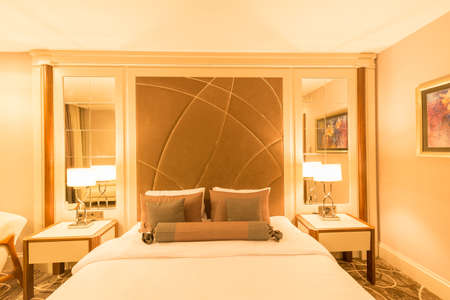 Modern hotel room with big bedの写真素材