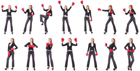 Woman businesswoman with boxing gloves on whiteの写真素材