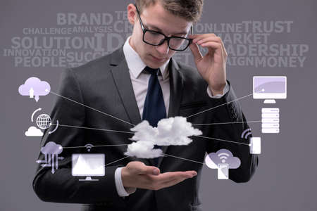 Young businessman in cloud computing conceptの写真素材