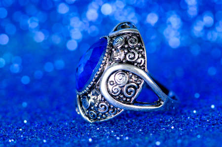 Jewellery ring against blue backgroundの写真素材