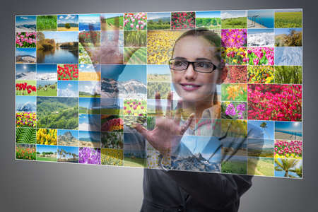 Businesswoman pressing virtual button on nature collage