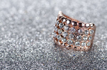Jewellery ring against shiny backgroundの写真素材