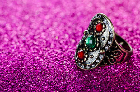Jewellery ring against shiny background
