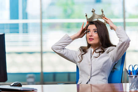 Businesswoman sitting at the office deskの写真素材