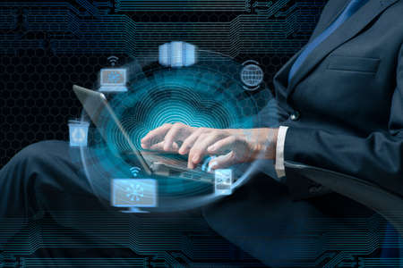 Businessman working with laptop in cloud computing concept
