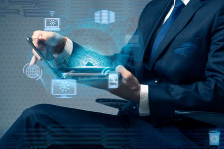 Businessman working with laptop in cloud computing concept