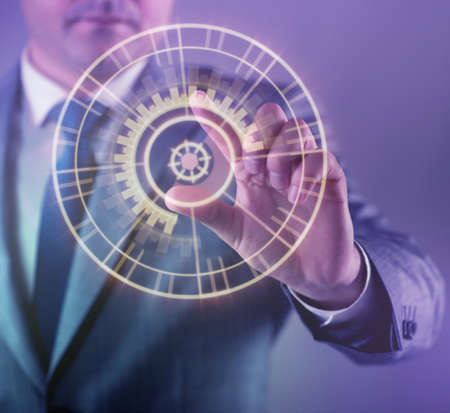 Businessman pressing virtual buttons in futuristic conceptの写真素材
