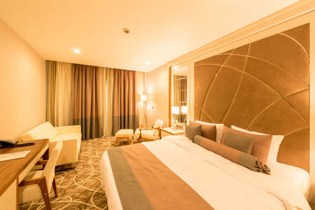 Modern hotel room with big bedの写真素材