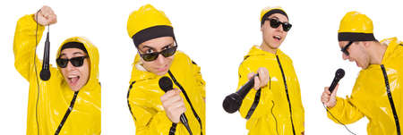 Funny performer with mic isolated on the whiteの写真素材