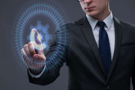 Businessman pressing virtual buttons in futuristic concept