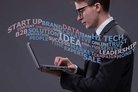 Young businessman with laptop in business concept
