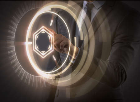 Businessman pressing virtual buttons in futuristic concept