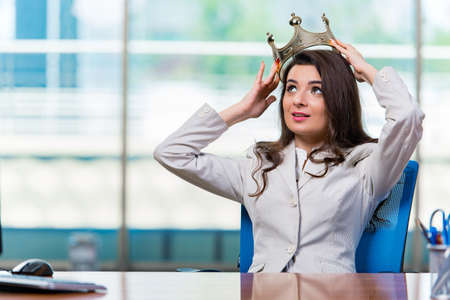Businesswoman sitting at the office deskの写真素材