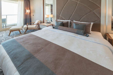Modern hotel room with big bed