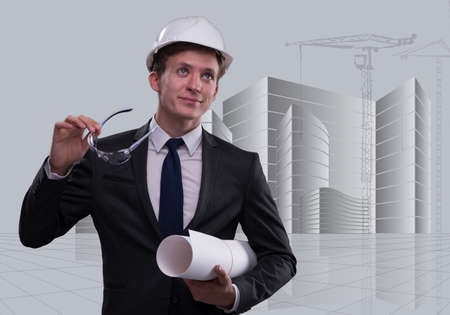 Young architect with drawings in composite conceptの写真素材