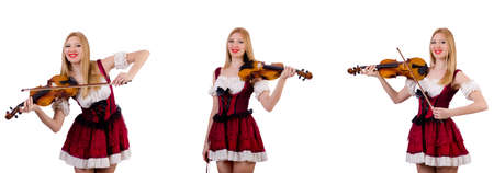 Bavarian girl playing the violin isolated on whiteの写真素材