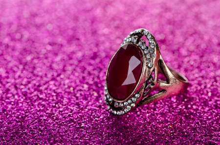Jewellery ring against shiny backgroundの写真素材