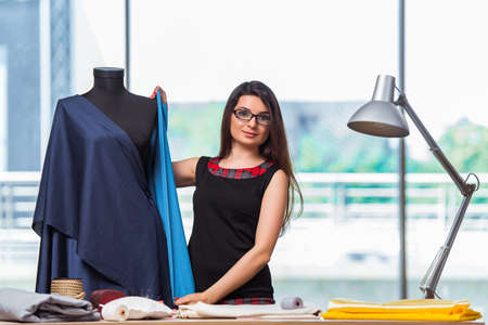 Woman tailor working on new clothing