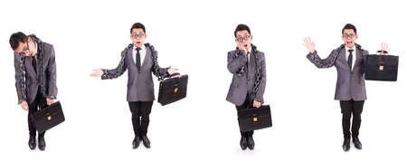 Businessman chained isolated on white