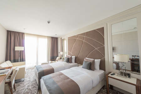 Modern hotel room with big bed